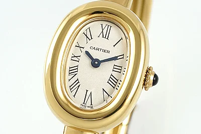 Cartier Baignoire Yellow Gold Oval Bangle Watch with Cream Dial, Roman Numerals, and Black Cabochon Crown